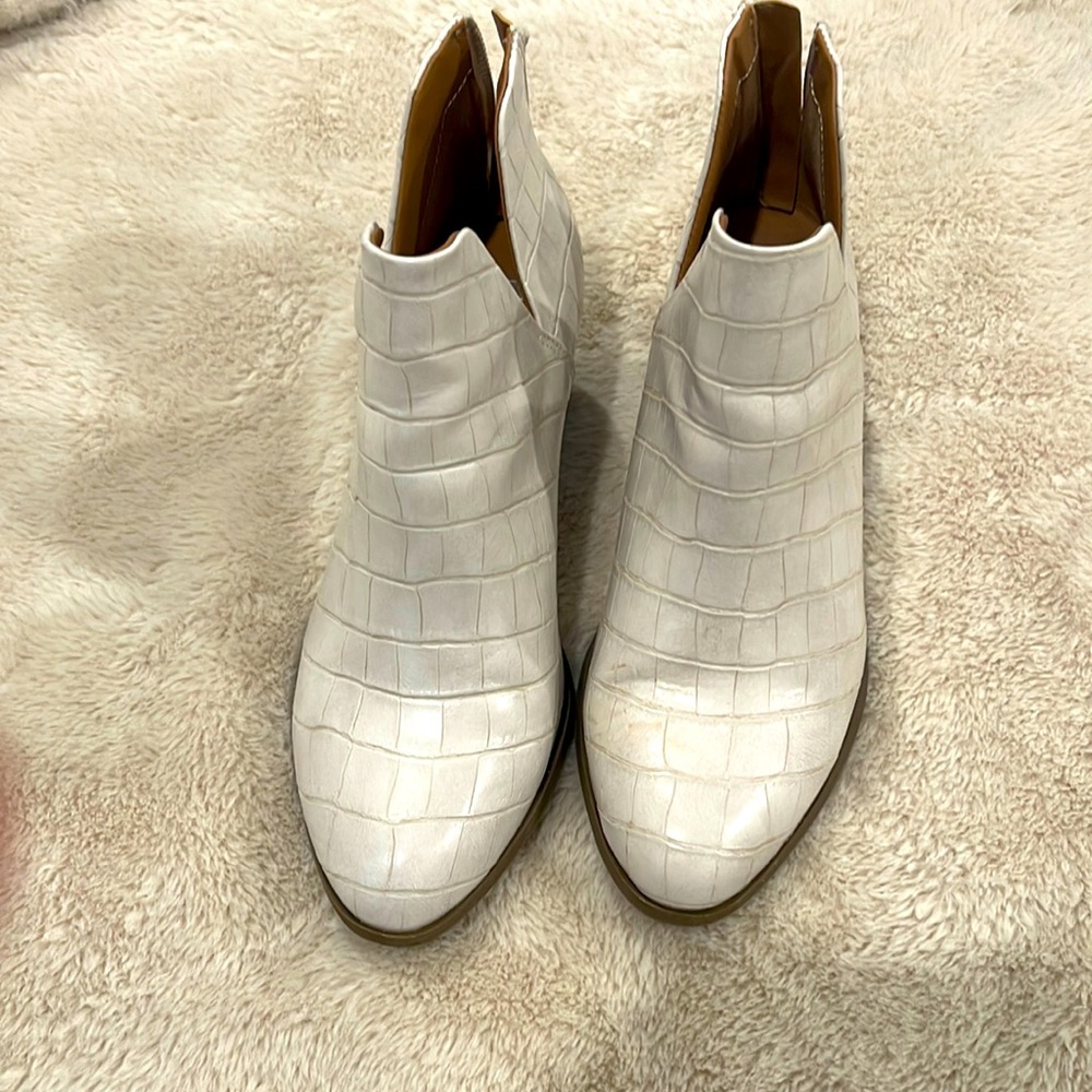White, small heel booties.